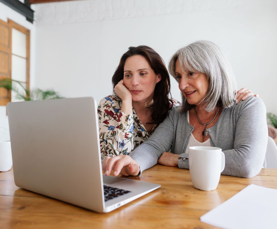 Mother And Her Daughter Using Laptop At Home. Mother And Her Daughter Using Laptop At Home.